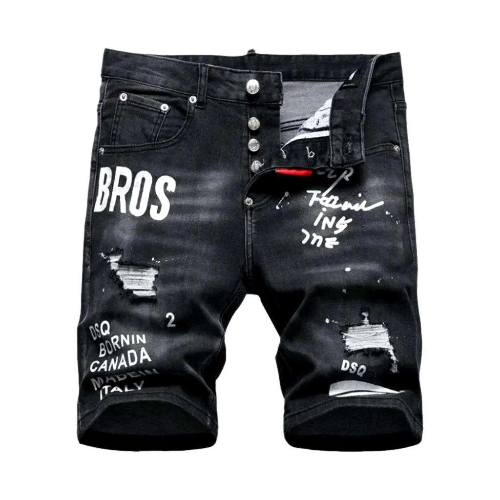 Black inscribed ripped denim shorts