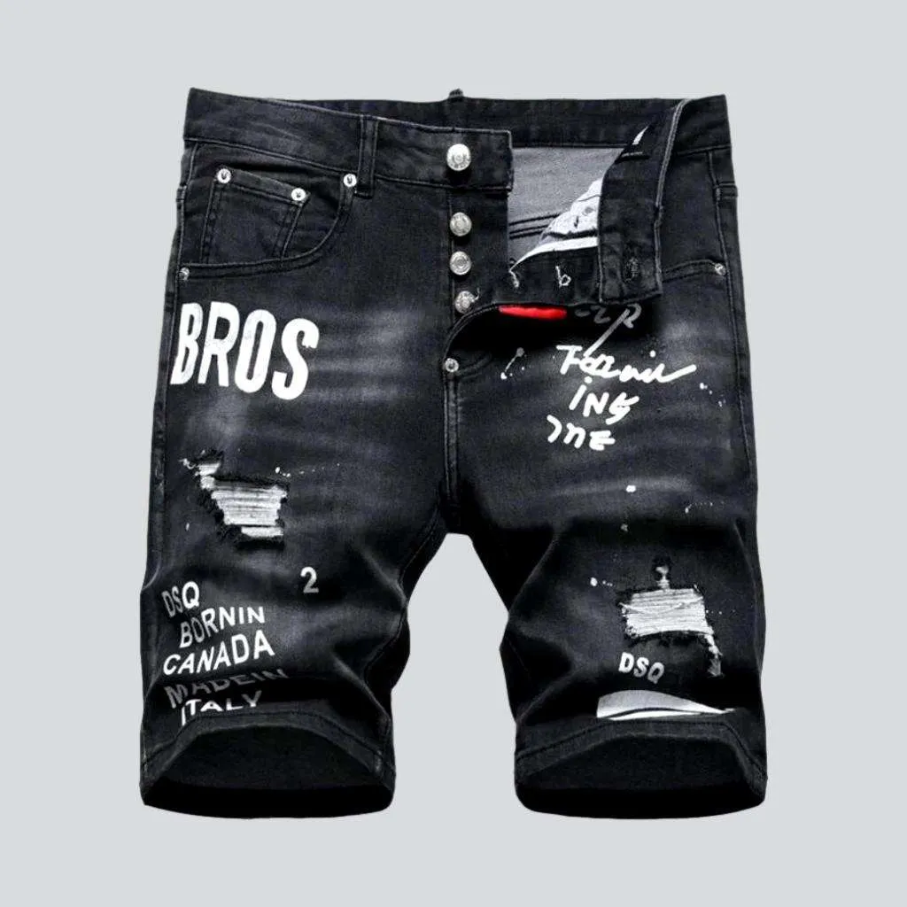 Black inscribed ripped denim shorts